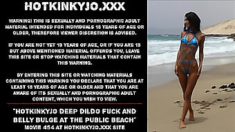 Deepthroating With A Dildo At A Public Beach, Resulting In A Noticeable Belly Bulge